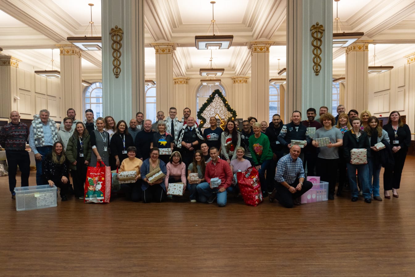 Community members gathered at a wrapping event